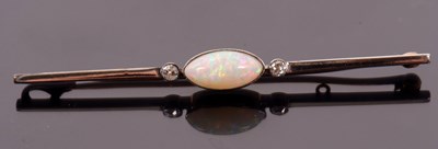 Lot 179 - An opal and diamond bar brooch, the central...