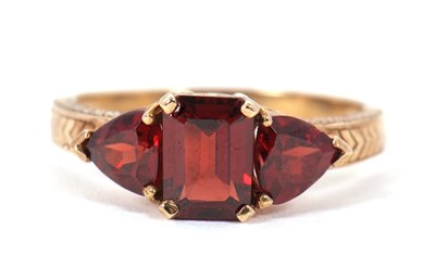 Lot 76 - A 9ct garnet ring, set with a step cut garnet...