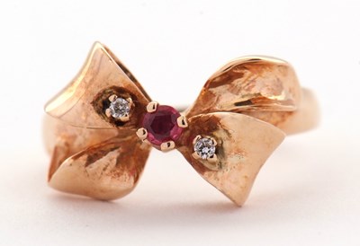 Lot 74 - A 14ct ruby and diamond bow ring, the bow set...