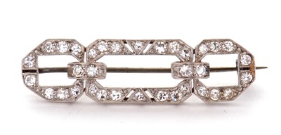 Lot 153 - An Art Deco diamond brooch, the three panelled...