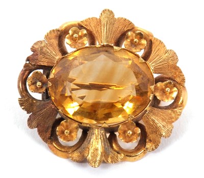 Lot 158 - A citrine brooch, the oval citrine in a collet...