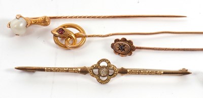 Lot 205 - Three stick pins and a brooch: to include a...