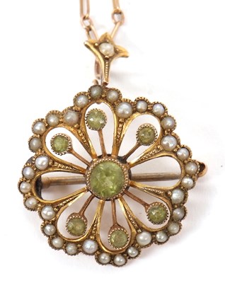 Lot 173 - A peridot and split pearl pendant/brooch, set...