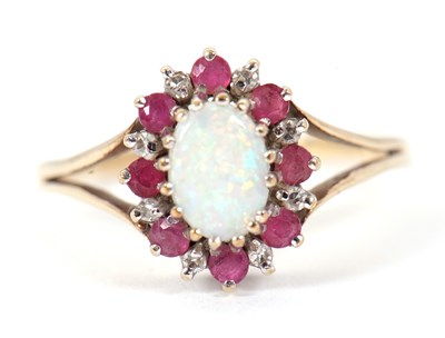 Lot 55 - A 9ct opal, ruby and diamond ring, the oval...