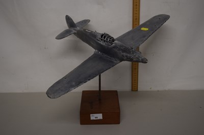 Lot 98 - A metal model of a plane on wooden base