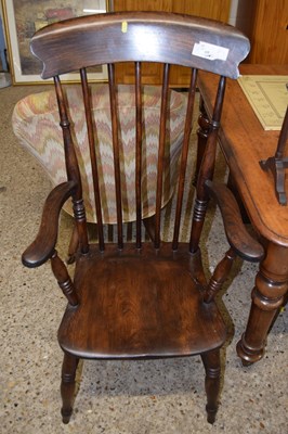 Lot 306 - A stained pine stick back chair