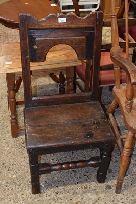 Lot 323 - An oak chair