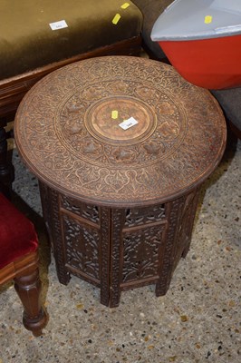 Lot 344 - An Eastern hardwood side table