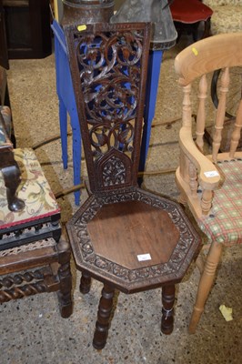 Lot 361 - A rustic carved hall chair