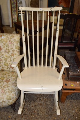 Lot 391 - A cream painted rocking chair