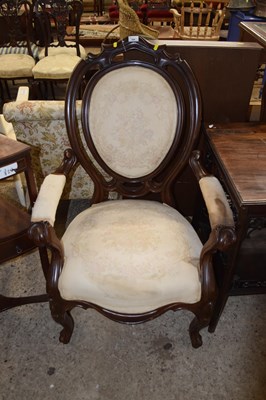 Lot 398 - A shield back upholstered armchair