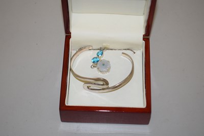 Lot 134 - A silver bangle and gemstone necklace (2)