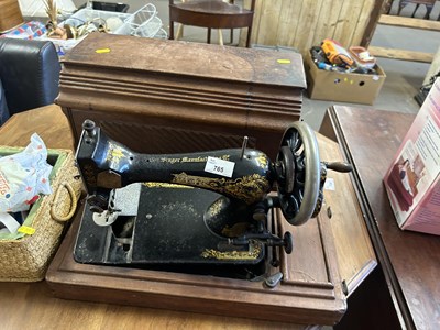 Lot 765 - A Singer sewing machine together with various...