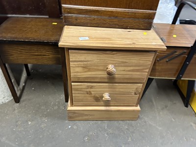 Lot 779 - Small two drawer pine bedside table together...