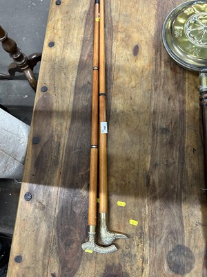 Lot 787 - Two brass topped collapsible walking sticks