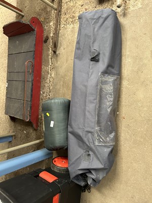 Lot 1019 - A sleeping bag together with a folding camping...