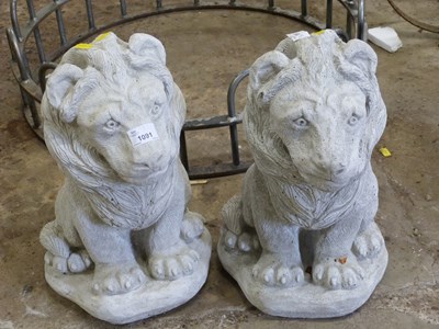 Lot 1091 - Two composite garden statues, modelled as lions