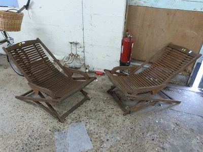 Lot 1097 - Two hardwood garden recliners