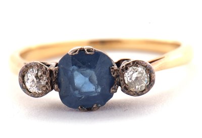 Lot 4 - A sapphire and diamond ring, the central pale...