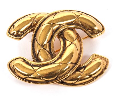 Lot 346 - A Chanel brooch, the quilted CC logo in gilt...