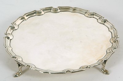 Lot 13 - George V silver card salver of plain circular...