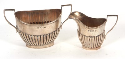 Lot 22 - A George V silver cream jug and twin handled...