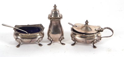 Lot 32 - A George VI silver three piece condiment set...