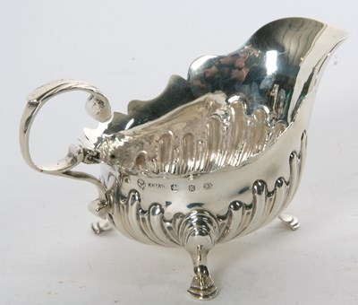 Lot 61 - Late Victorian silver sauce boat having a card...