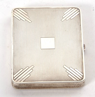 Lot 90 - An Art Deco silver cigarette case engine...