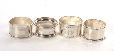 Lot 92 - Group of four silver serviette rings, various...