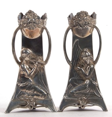 Lot 118 - A pair of WMF Art Nouveau candlesticks of...