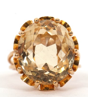 Lot 3 - A citrine ring, the oval mixed cut citrine,...