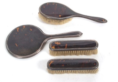 Lot 139 - George V silver and tortoiseshell dressing...