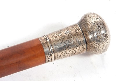 Lot 145 - An Edwardian silver topped walking stick cane,...