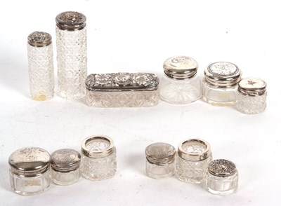 Lot 154 - Group of eleven silver mounted glass dressing...