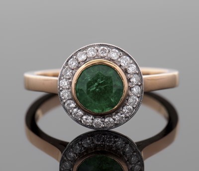 Lot 443 - An 18ct emerald and diamond ring, the round...