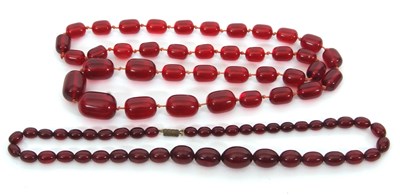 Lot 326 - Two 'cherry amber' bead necklaces, one with...