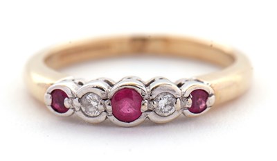 Lot 32 - A 9ct ruby and diamond ring, the alternating...