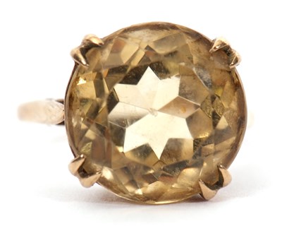 Lot 36 - A 9ct citrine ring, the round faceted citirine,...