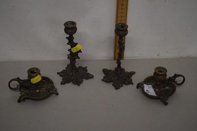 Lot 63 - Two small pairs of brass candlesticks