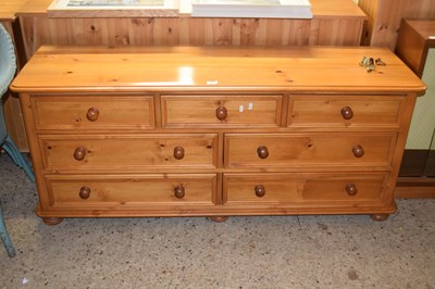 Lot 272 - Modern pine seven drawer sideboard