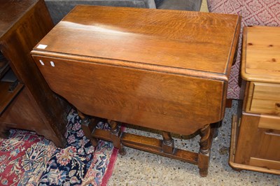 Lot 303 - Oak dropleaf dining table on barley twist legs