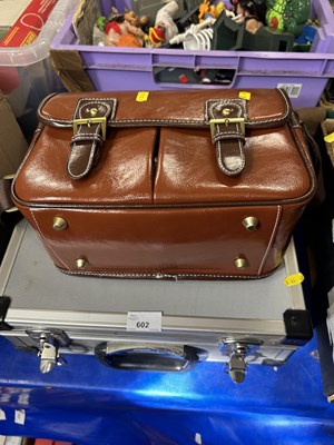 Lot 602 - Aluminium hard shell suit case and a bowles bag