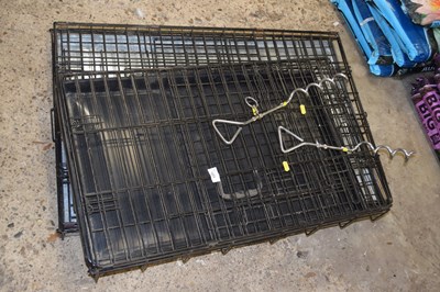 Lot 1027 - Two dog cages together with ground anchors