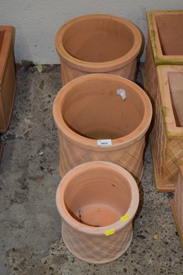 Lot 1033 - Three round terracotta planters