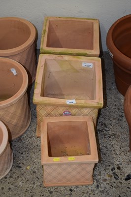 Lot 1034 - Three square terracotta planters