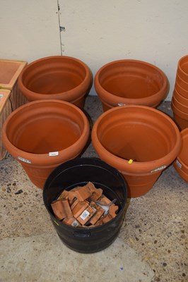 Lot 1035 - Four large terracotta planters together with a...