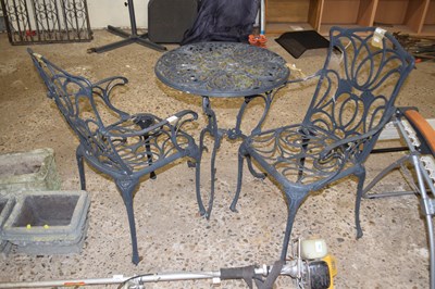 Lot 1053 - Cast bistro set, table and two chairs