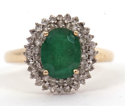 Lot 8 - A 9ct emerald and diamond cluster ring, the...