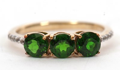 Lot 16 - A 9ct diopside and white stone ring, the three...